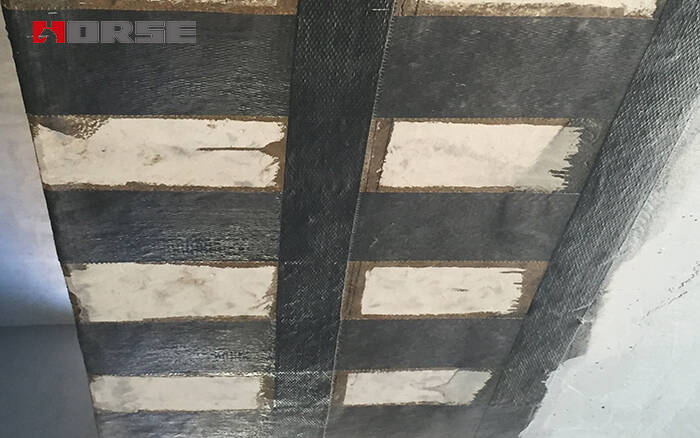 Beam strengthening by carbon fiber wrapping Beam strengthening by carbon fiber wrapping