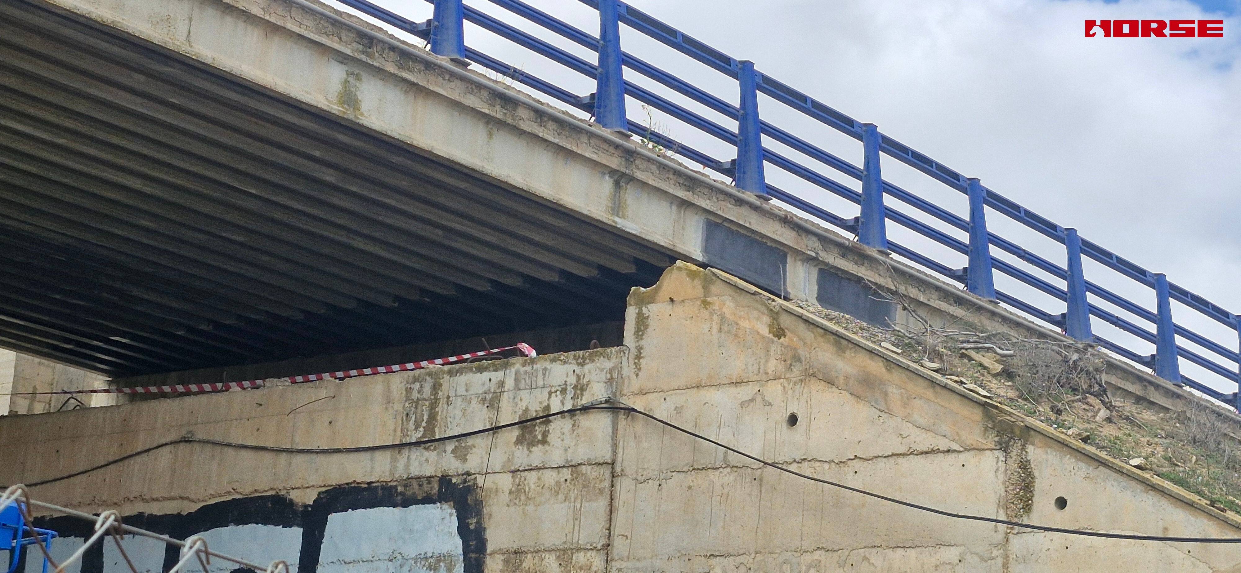 Strengthening of a Prestressed Concrete Multi-Girder Bridge with CFRP Laminate and U-warp Strengthening of a Prestressed Concrete Multi-Girder Bridge with CFRP Laminate and U-warp